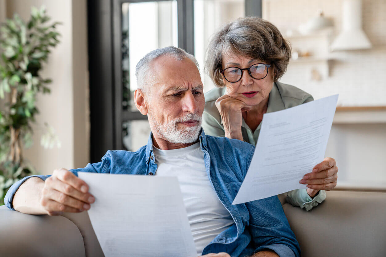 Senior grandparents reading estate planning and wills